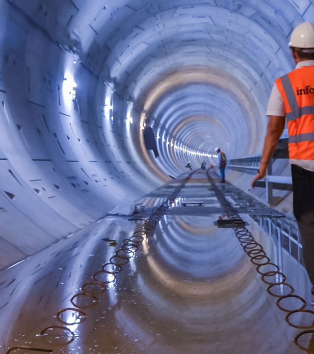 Man walking through underground tunnel